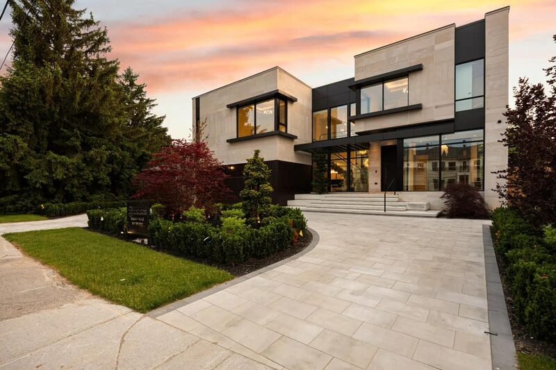 A modern angular custom home at dusk