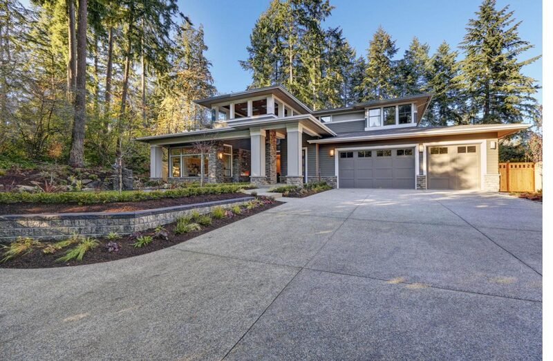 A modern stone custom home in autumn