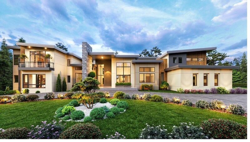 A modern low-slung home with warm lighting